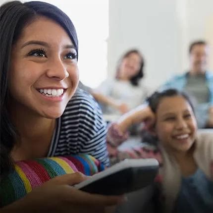 Girls smiling with remote control